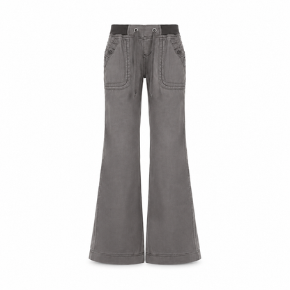 Jean American Vintage taille basse légèrement évasé, avec ceinture élastiquée à cordonnet et poches patteilleuses